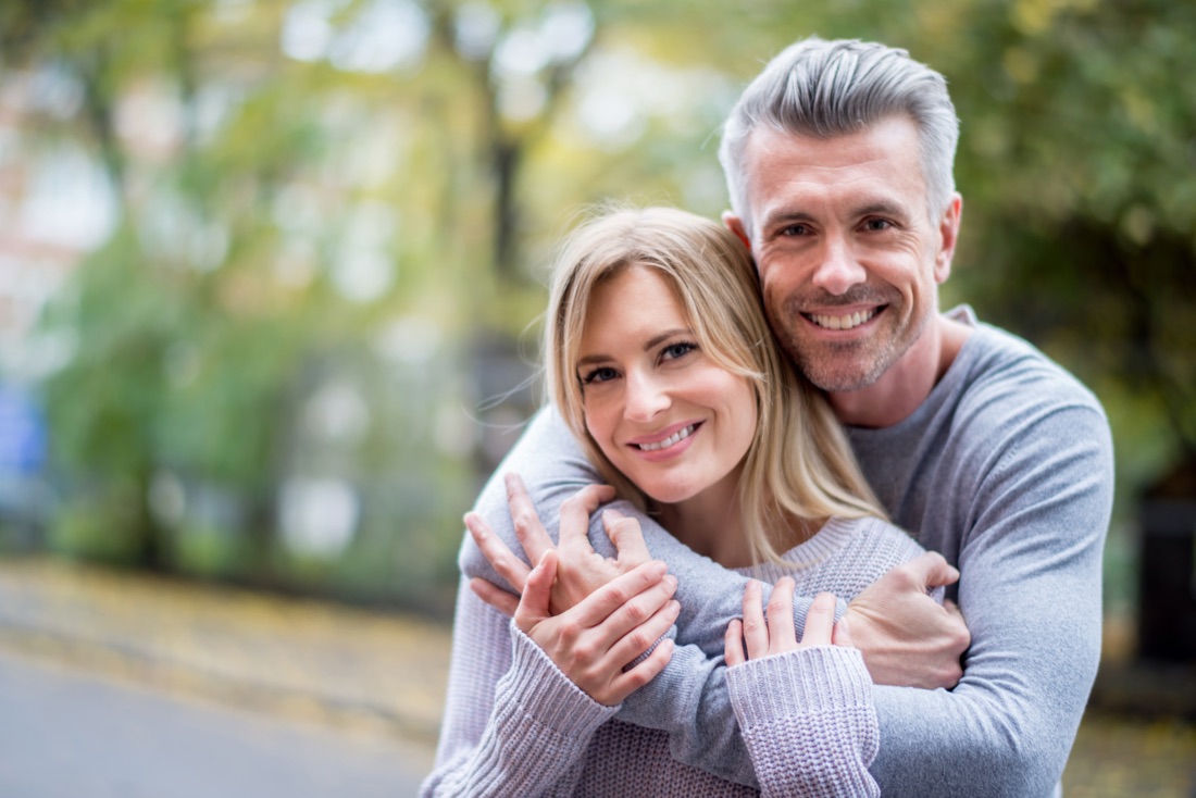 Happy mature couple after peptide therapy at our Coral Gables clinic